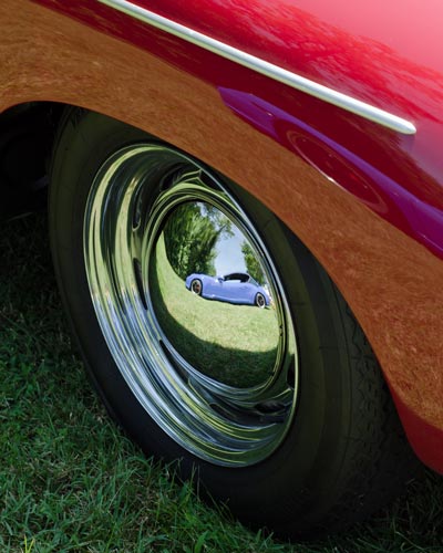 New Porsche reflected in 356 wheel