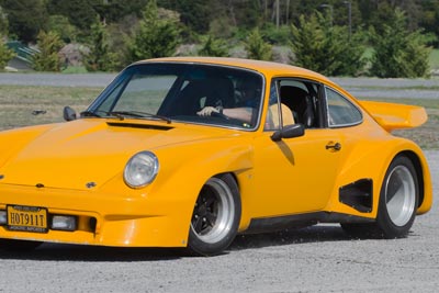 Photo of Rex McClure's yellow outlaw 911 at the autocross