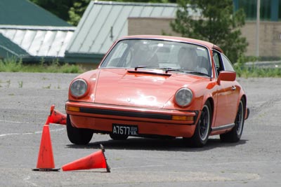 Photo of Steve Garstang's Boxster kicking up a spray of water