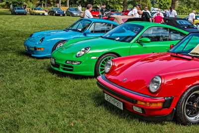 photo of blue, green,
and red Porsches at RPM