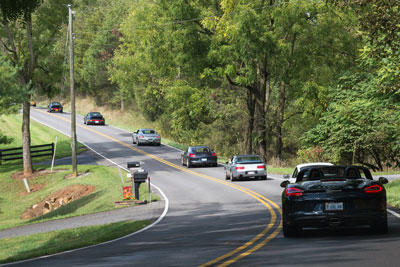 photo of Porsches driving
to Stable Craft Brewing